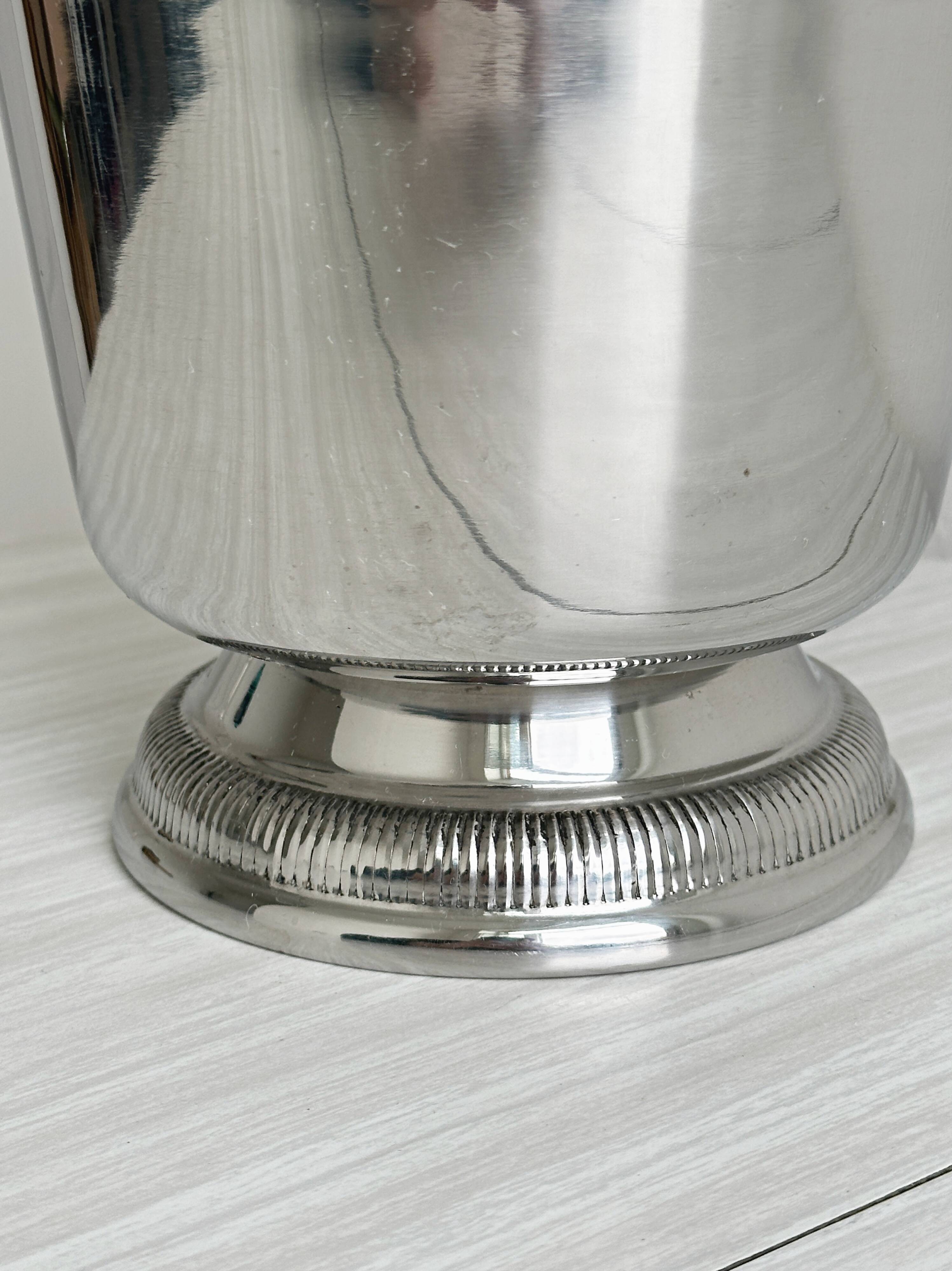 Shiny metal champagne bucket