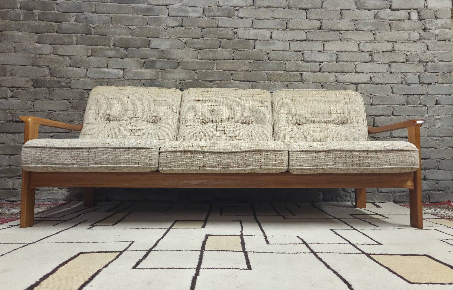 Danish canapé and its 1970s teak armchair