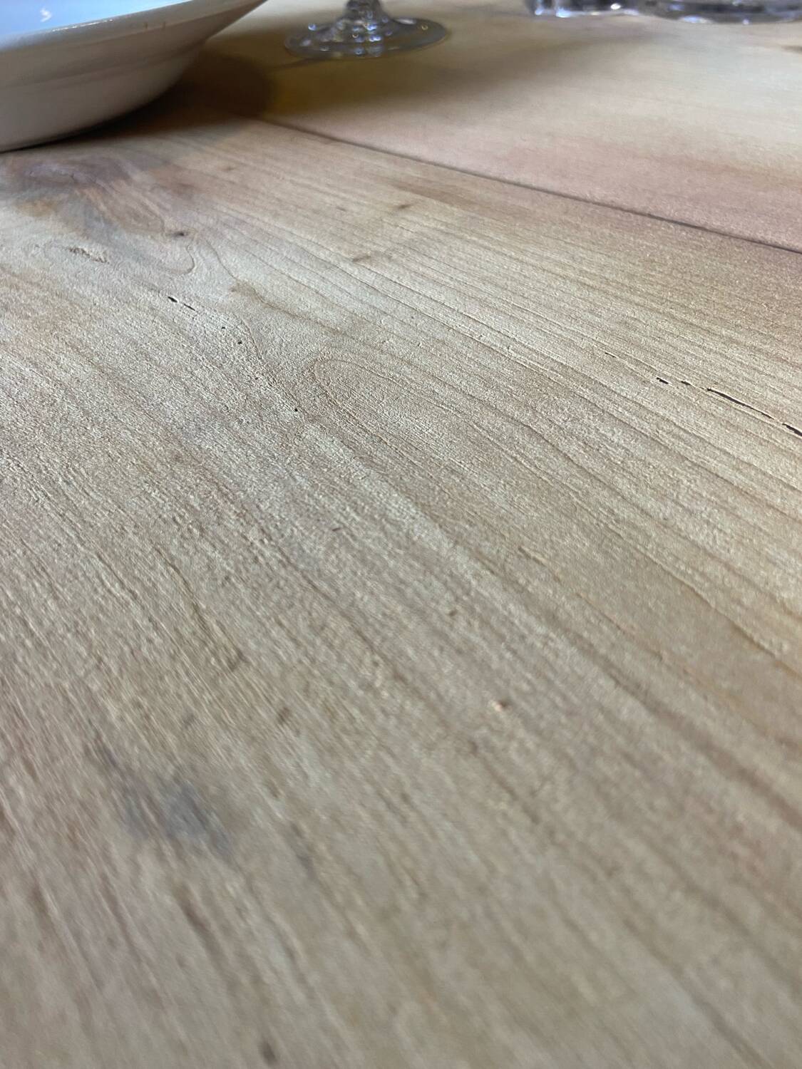 Oval wooden table on wheels.