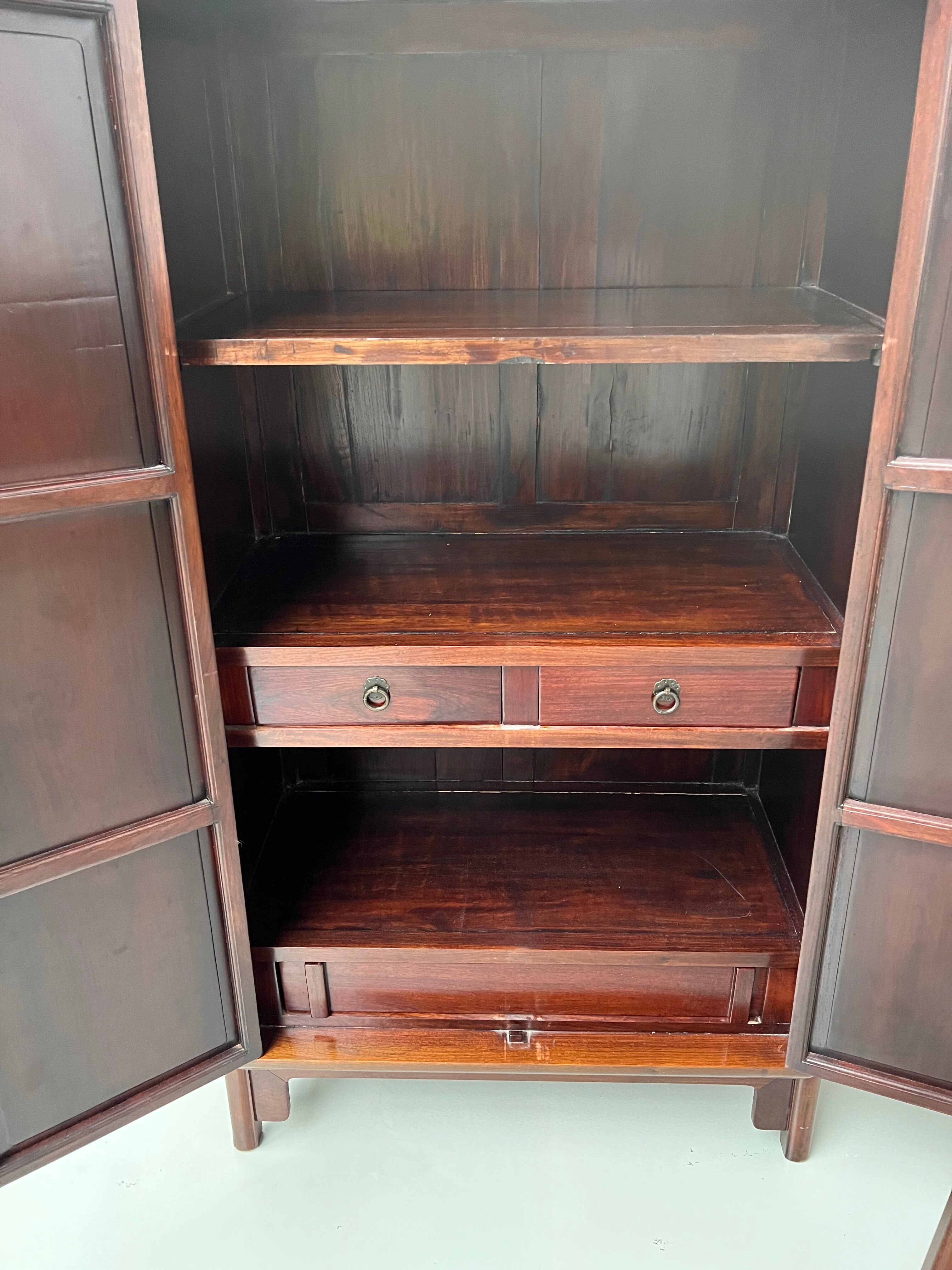 Chinese trapezoidal roller cabinet, made of rosewood.