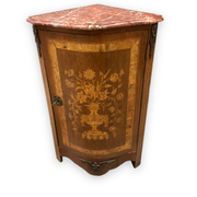 Louis XVI style corner buffet with marquetry decoration featuring a vase of flowers