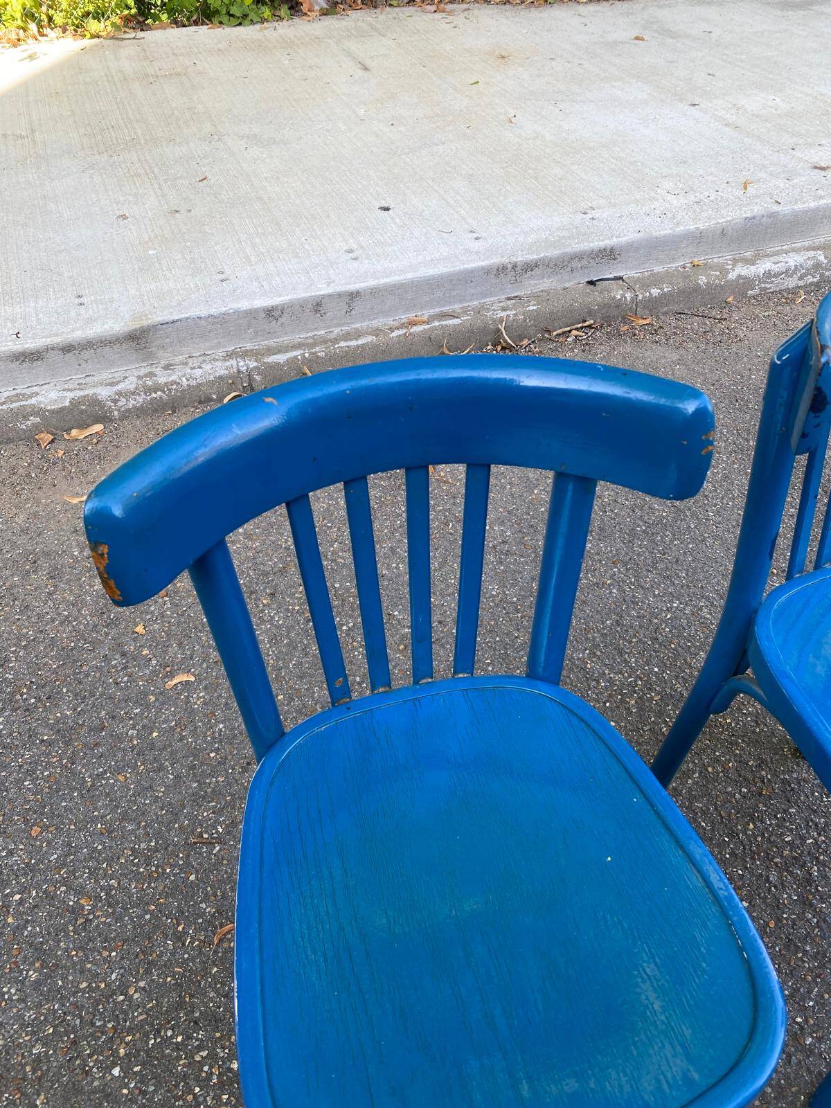 2 blue bistro chairs in curved solid wood