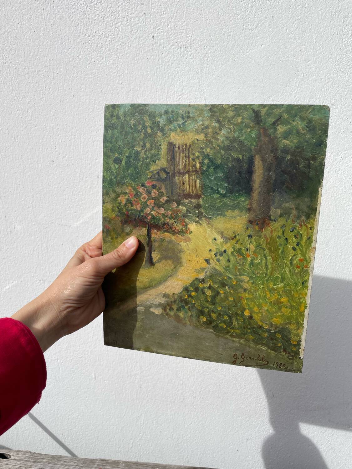 Paysage jardin à l’huile signé