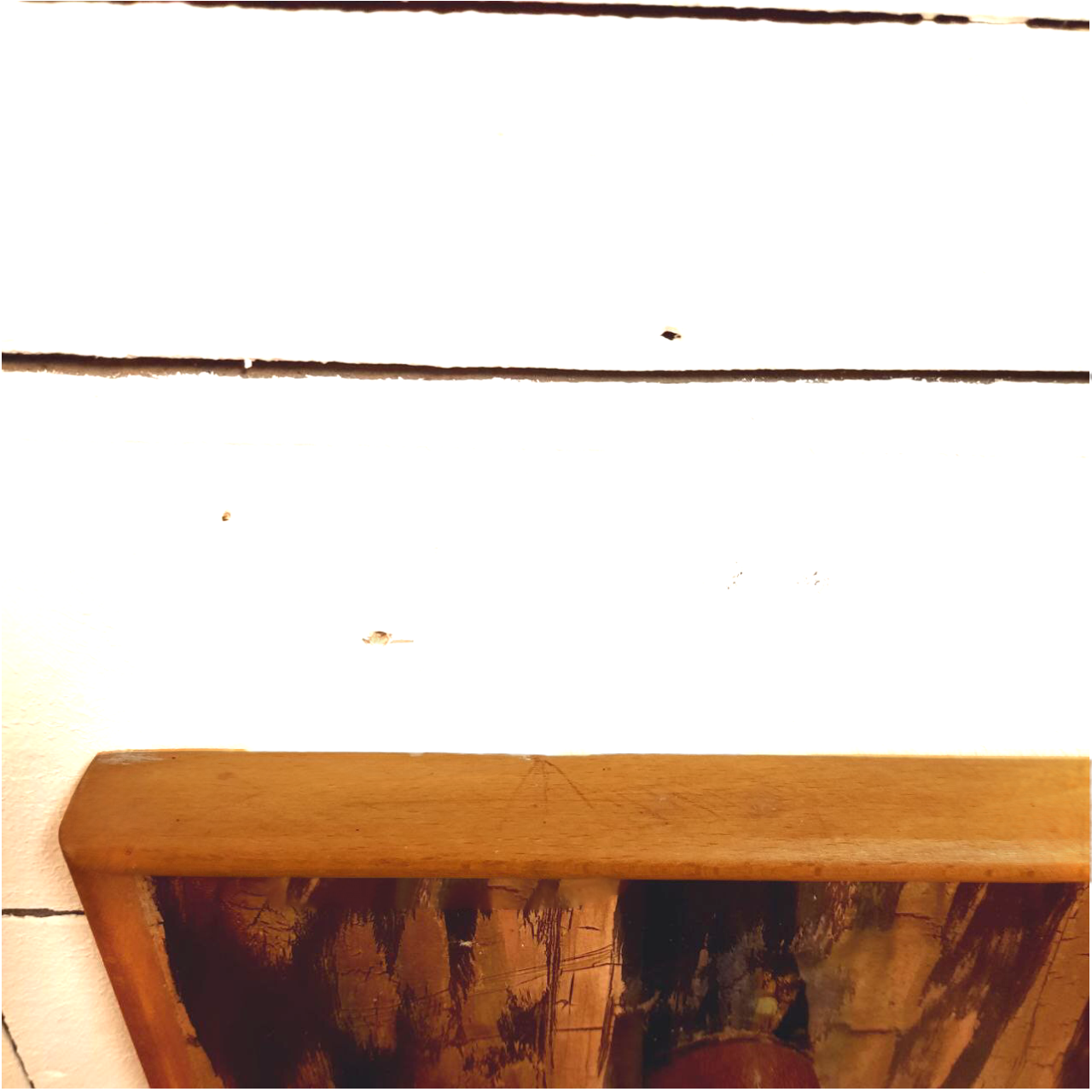 Vintage wooden coat hangers and glazed copper