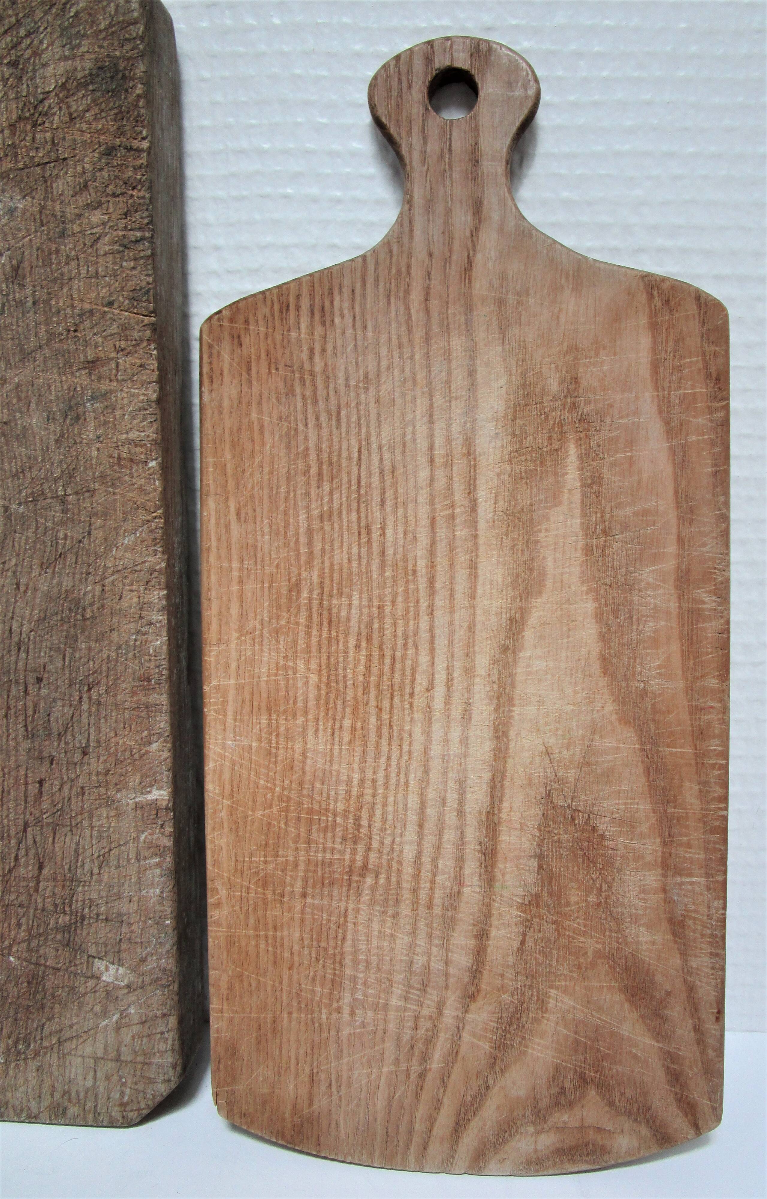 three vintage patinated solid wood cutting boards