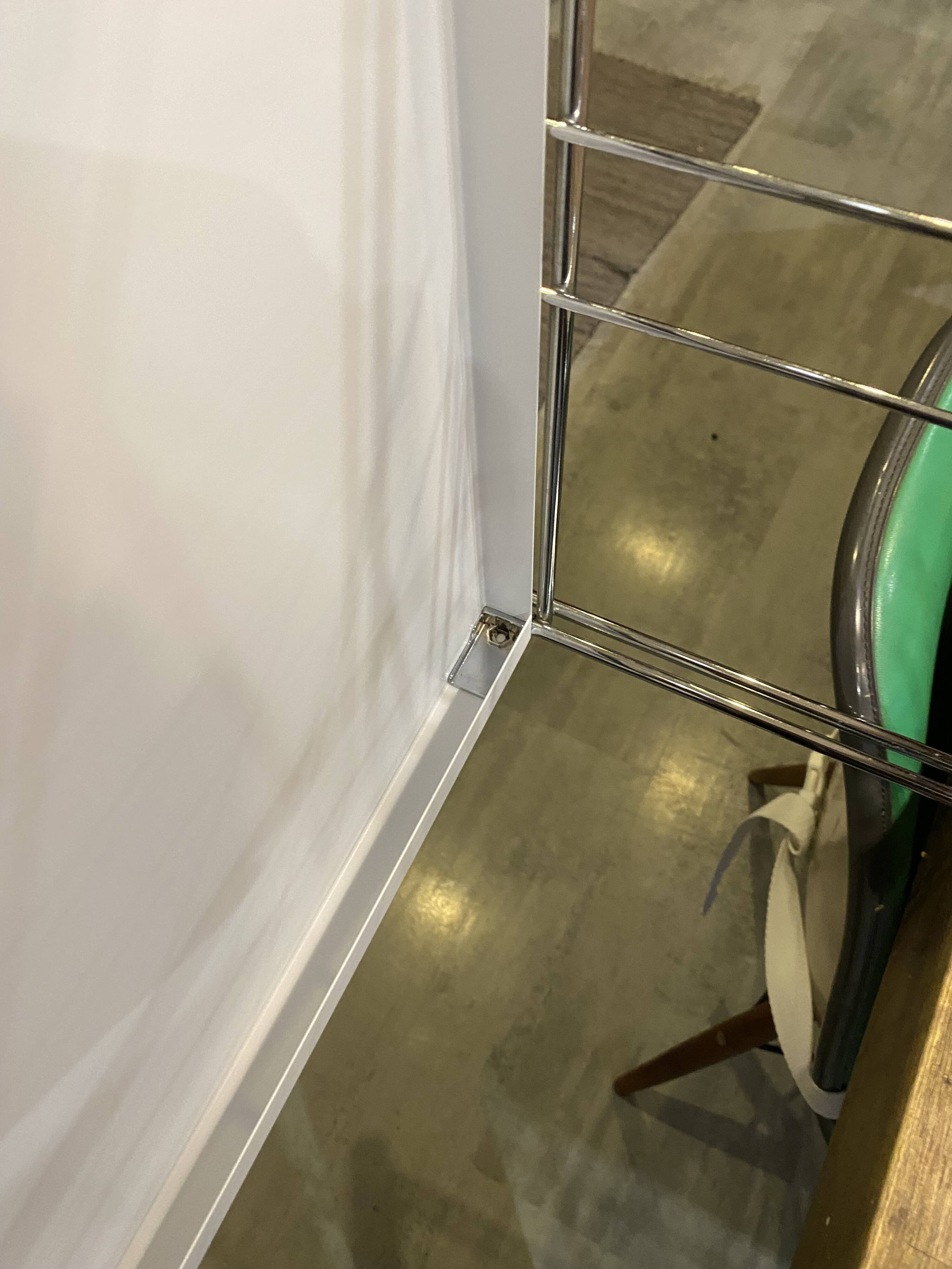 Modular wall bookshelf desk in vintage chrome.