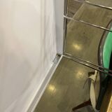 Modular wall bookshelf desk in vintage chrome.