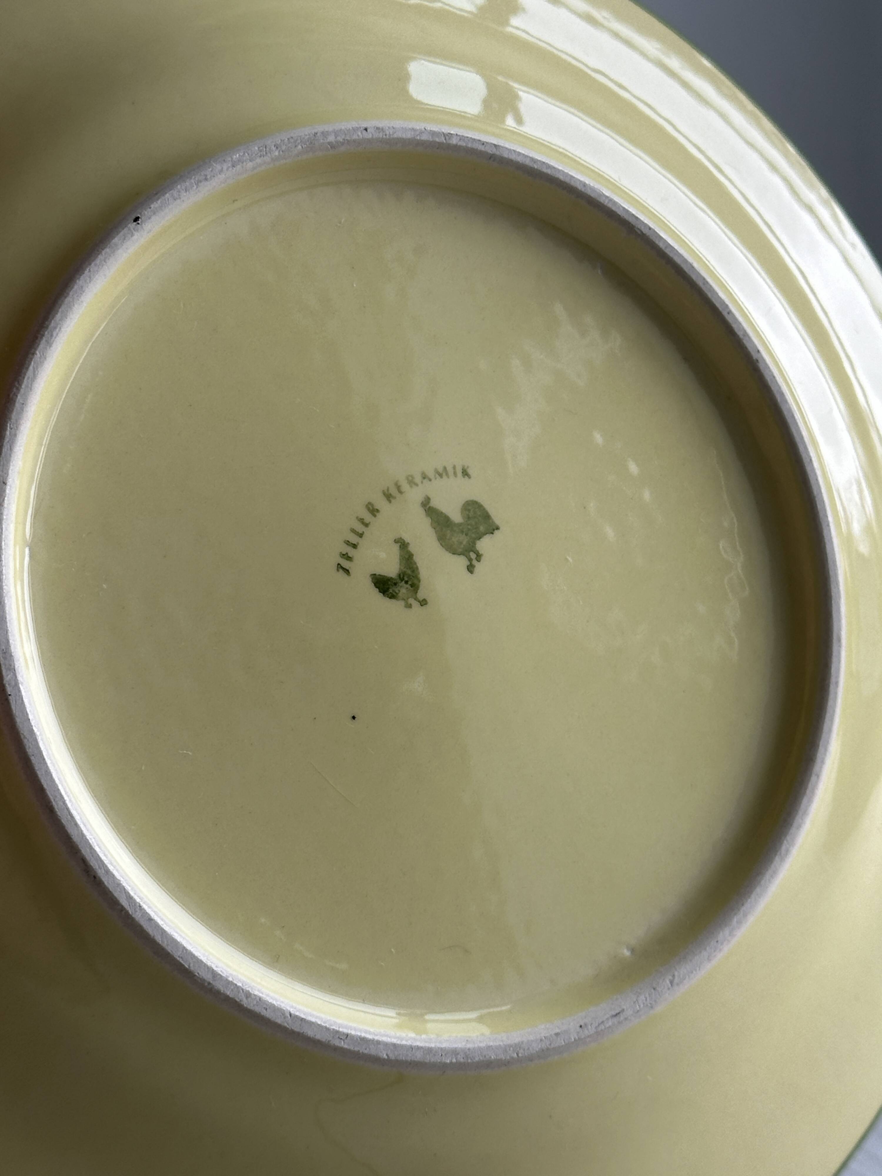 “Teller Keramik” ceramic plate with rooster motif.
