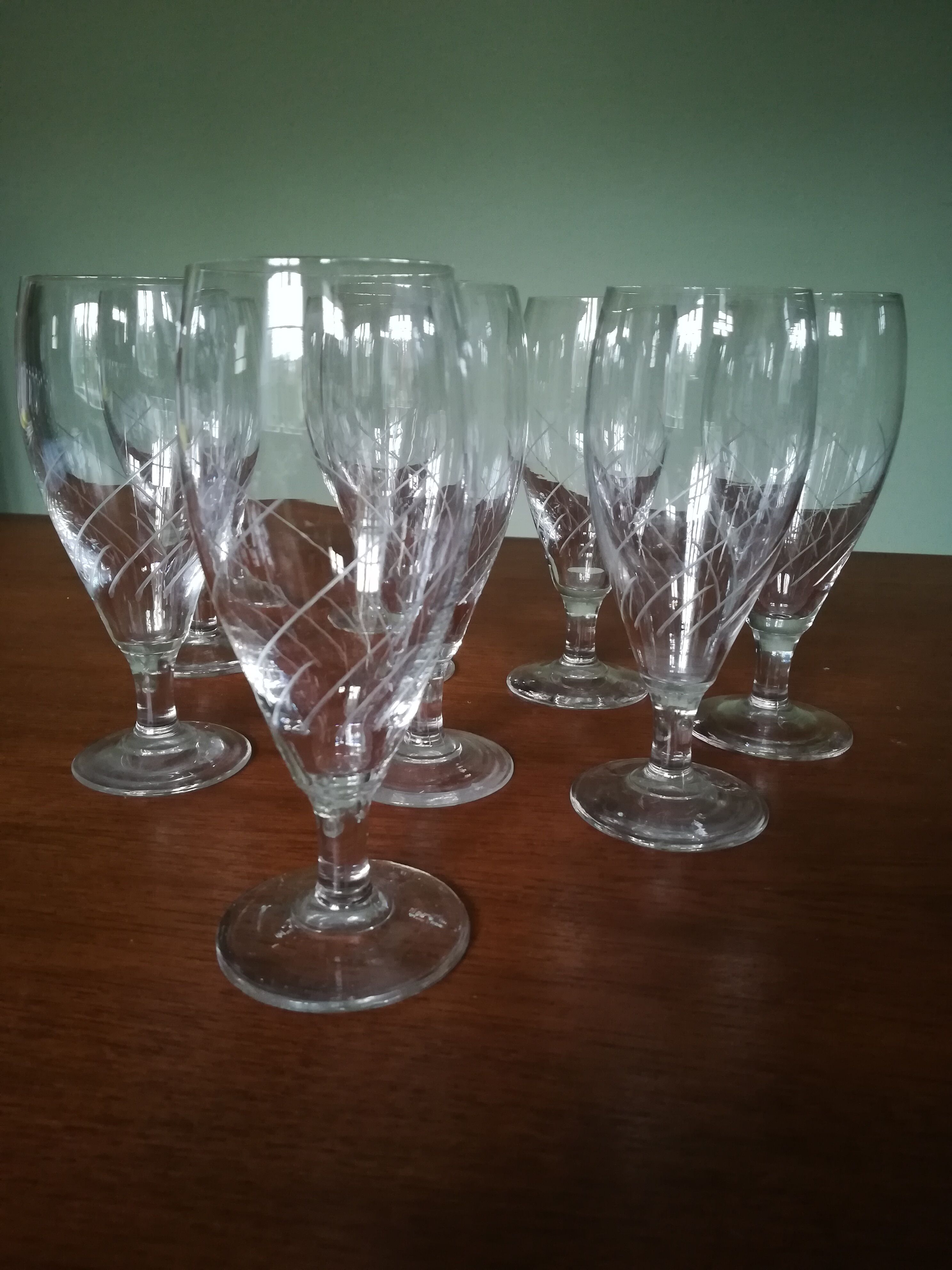Eight champagne flutes in engraved glass