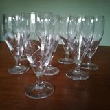 Eight champagne flutes in engraved glass