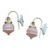 Pair of antique wall sconces with swan necks, brass, pink glass globes.