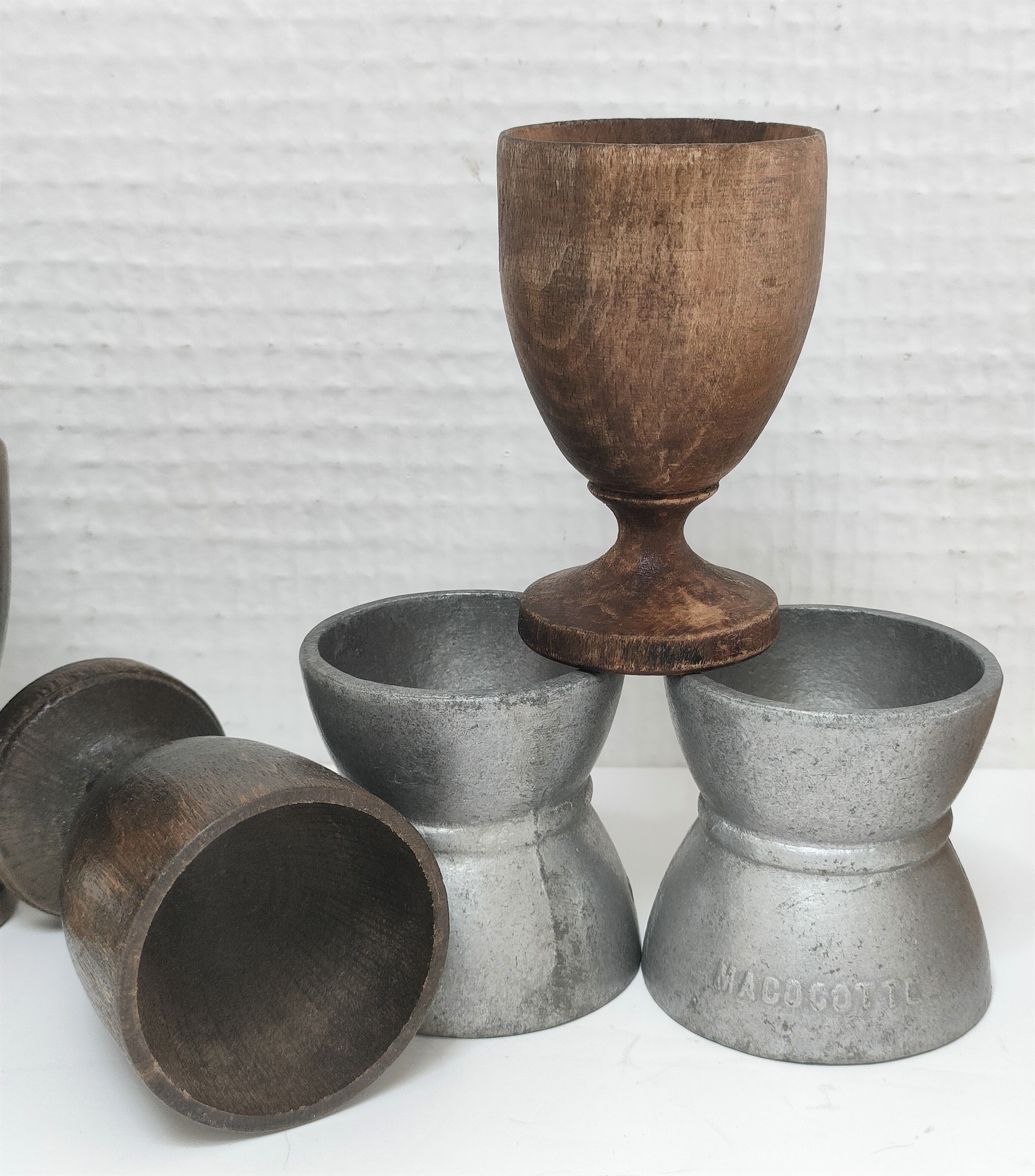 Set of twelve turned wood shells and vintage aluminum