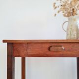 Old wooden table with its drawer