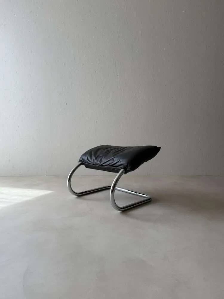 Swiss lounge chair with ottoman by Robert Haussmann from the 1980s.
