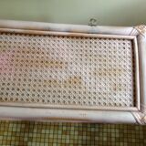 Pink rattan and cane shelf