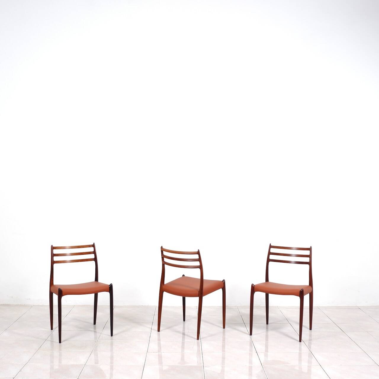 Set of 6 Niels Moller „Model 78“ rosewood dining chairs with cognac leather