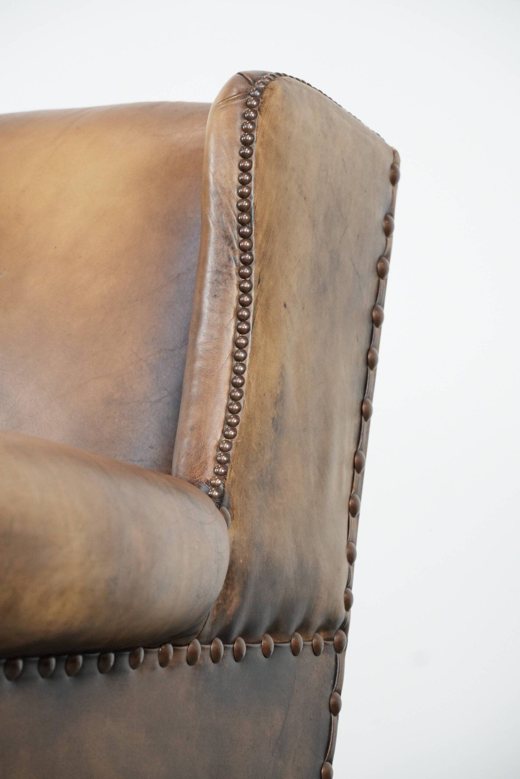 Luxury and large cowhide leather wingback chair in English style