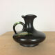 Thulin Belgium pitcher, black ceramic handle