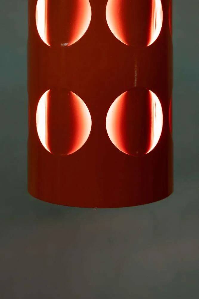 Vintage orange suspension light in a 1970s space age style.