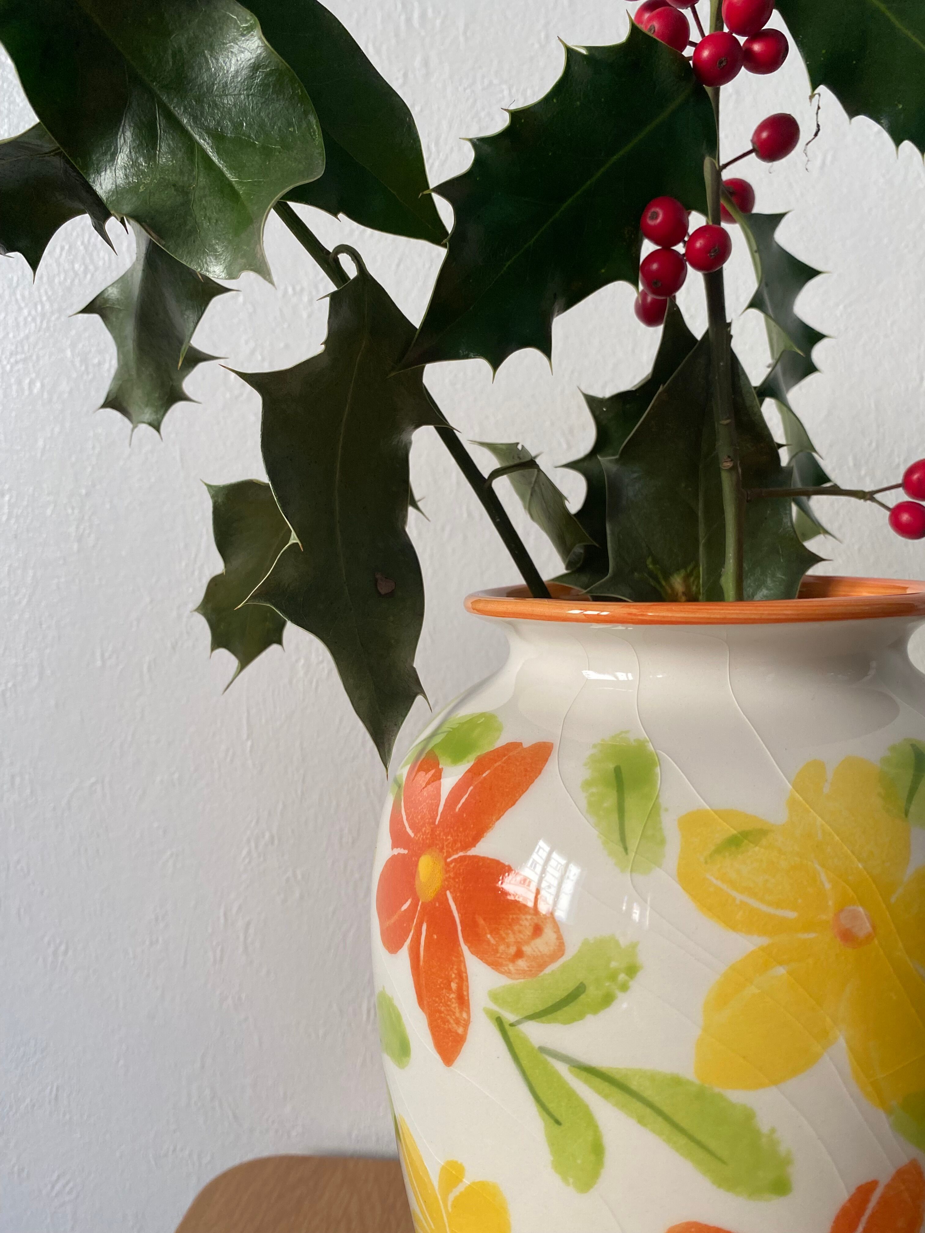 White vase with flowers