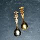 Set of 2 vintage gold metal salt spoons.
