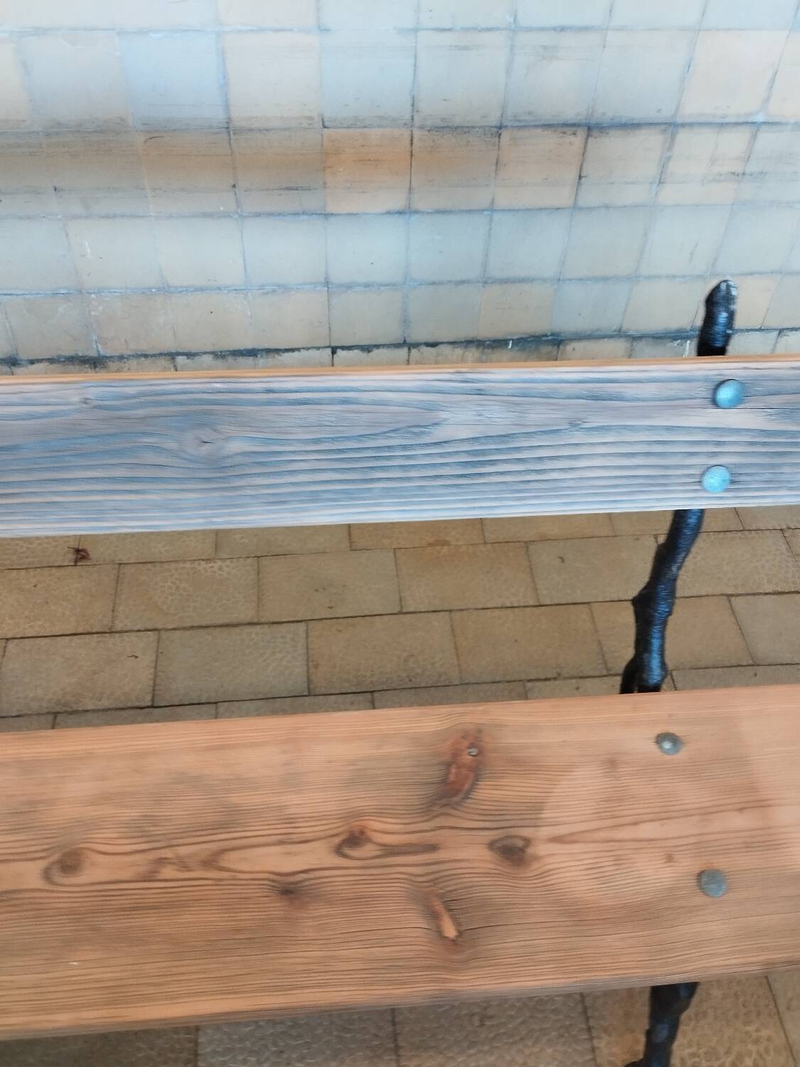 Antique garden bench with cast iron legs