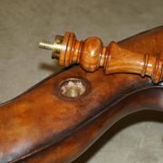 High Victorian leather tête-à-tête canapé with a walnut burr chessboard.