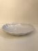 White dish with scallops by Emile Henry