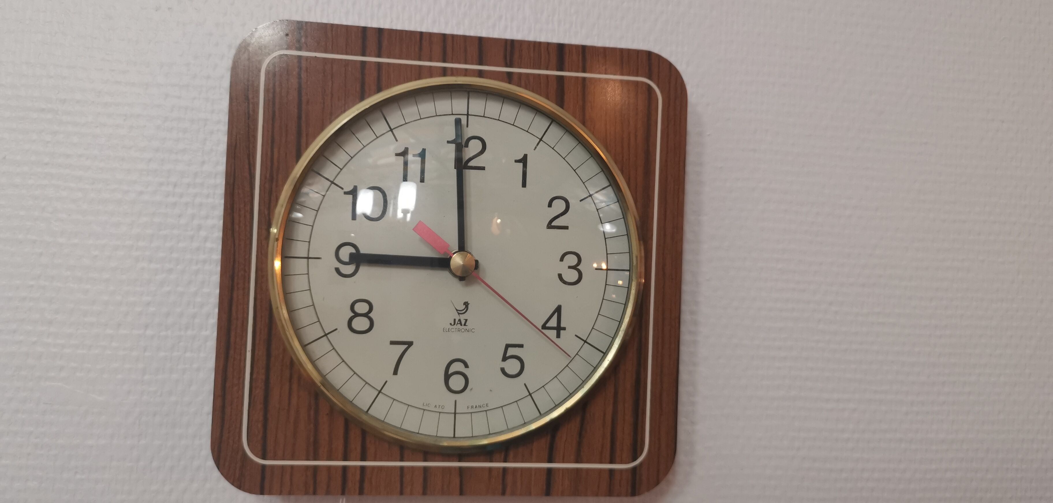 Old wall clock jaz quartz wall clock in formica brown 1960s