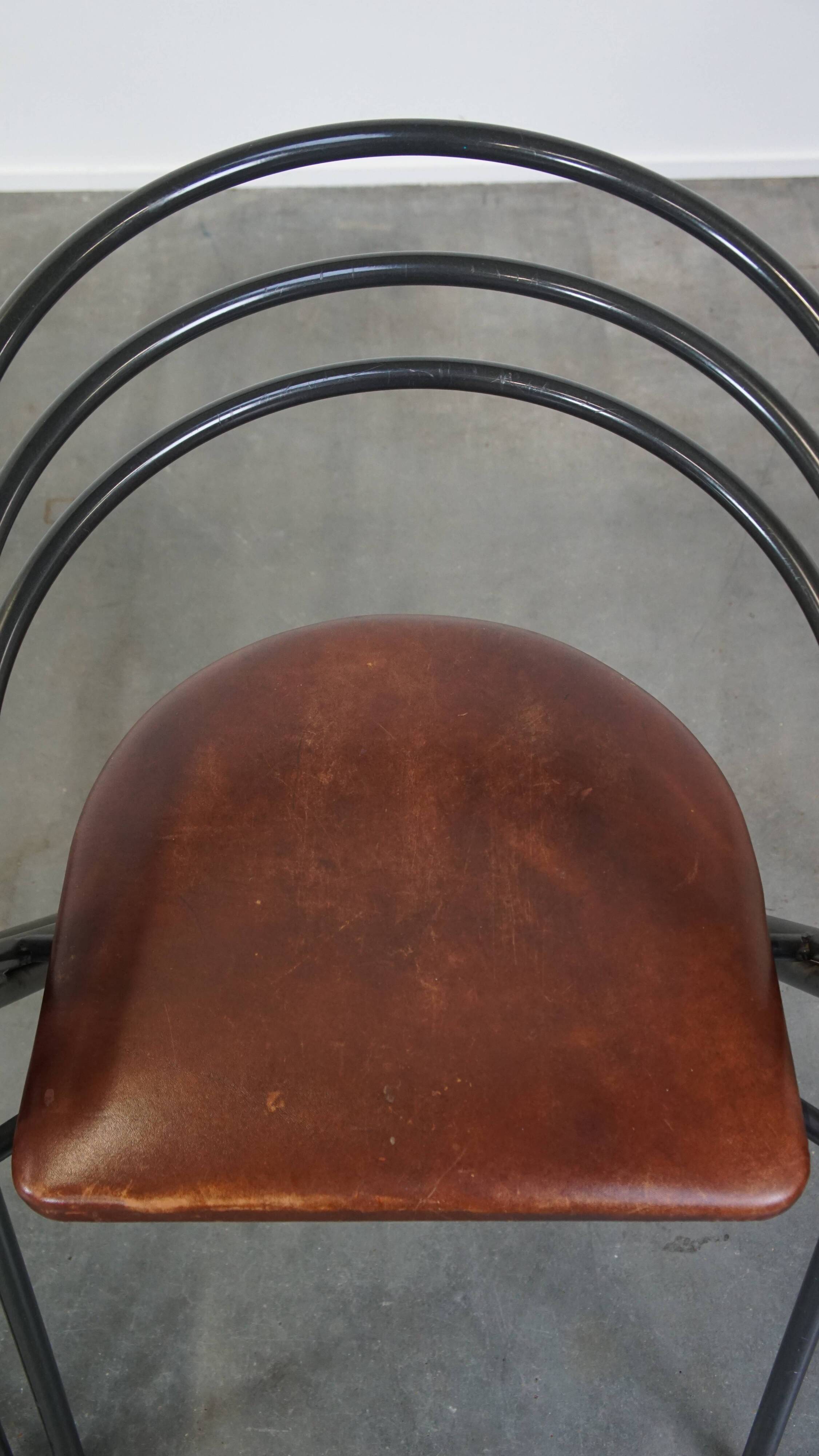 Set of 4 1970s design dining chairs with leather seats and metal frame