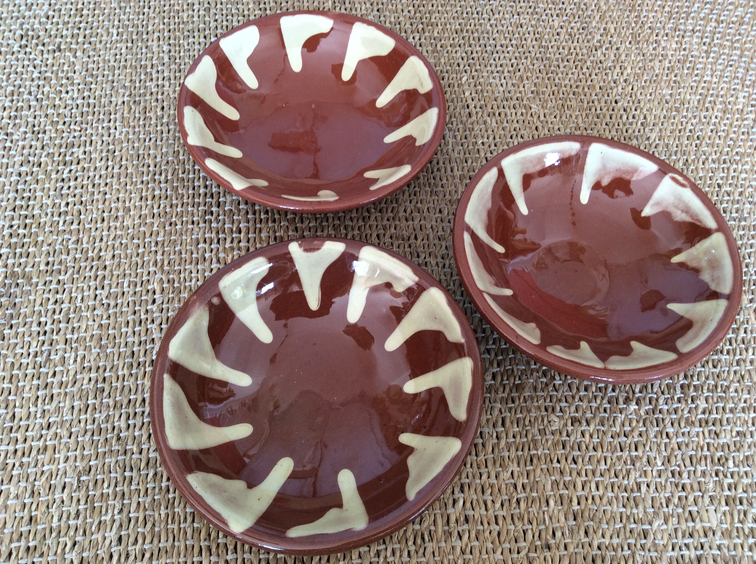 3 glazed terracotta plates