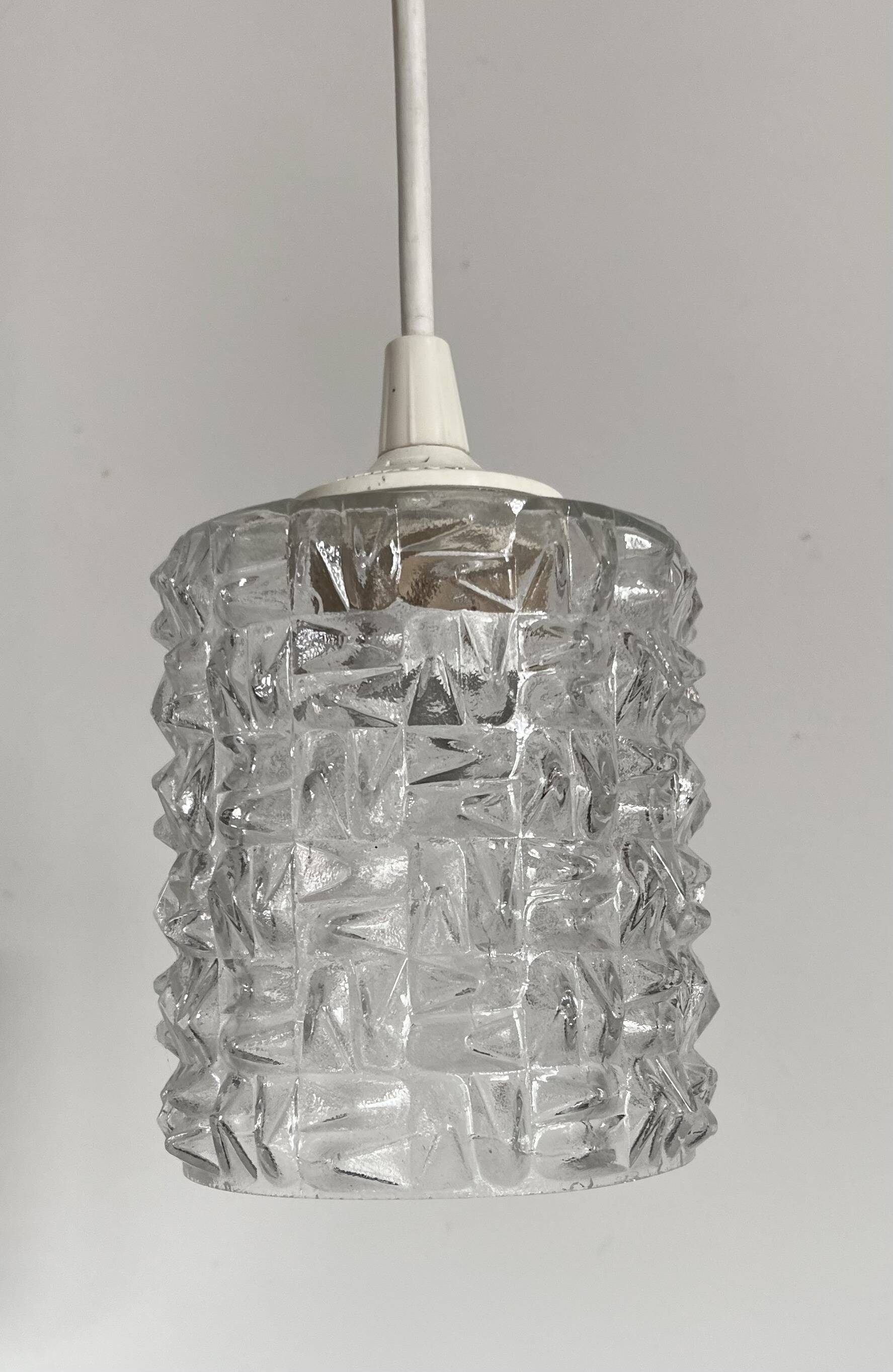 Small cylindrical molded glass pendant light