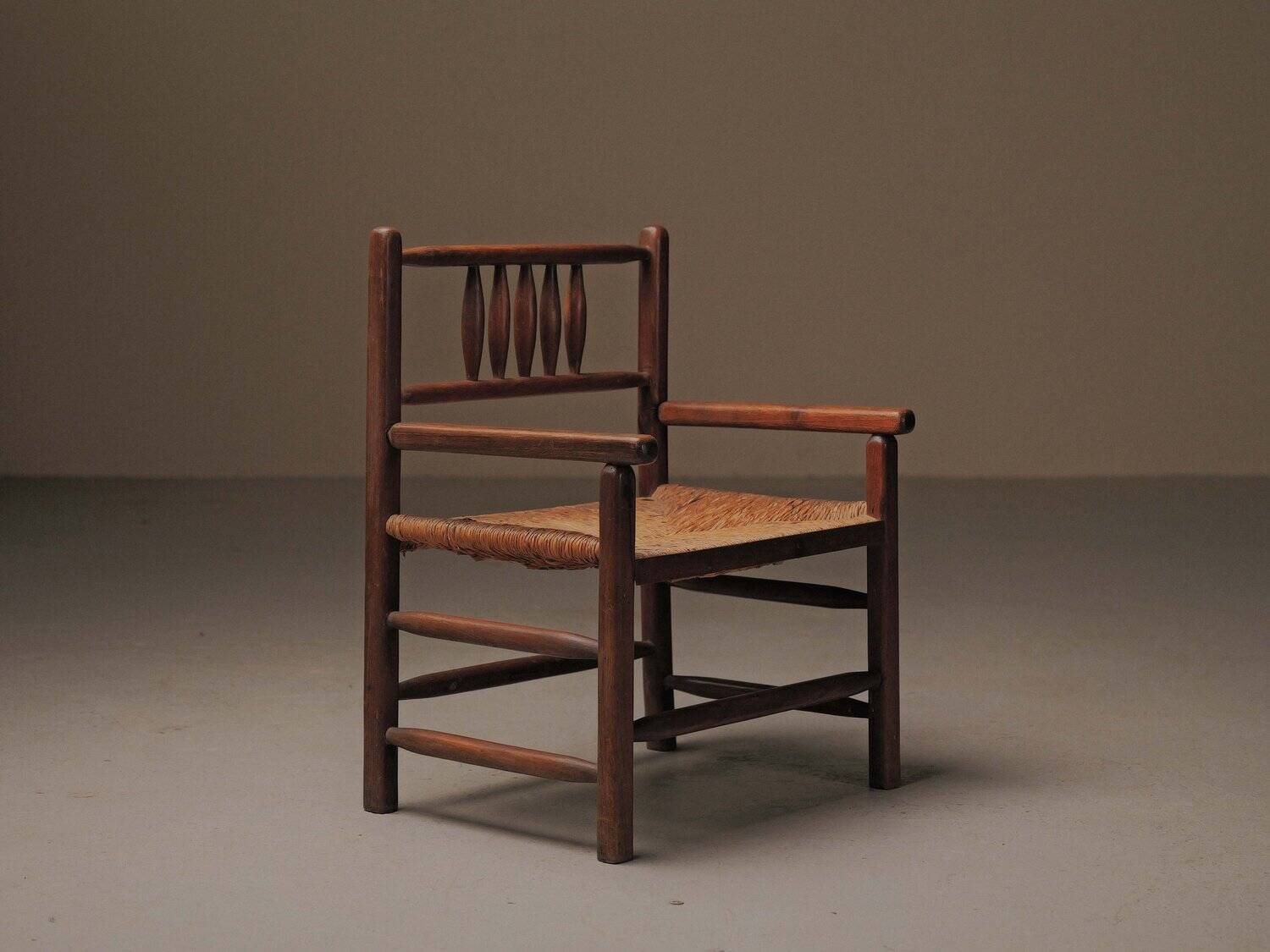 Wicker armchair in solid wood, handcrafted, France, around 1950.