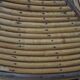 Round coffee table in bamboo, rattan, and wood with an 80s star pattern.