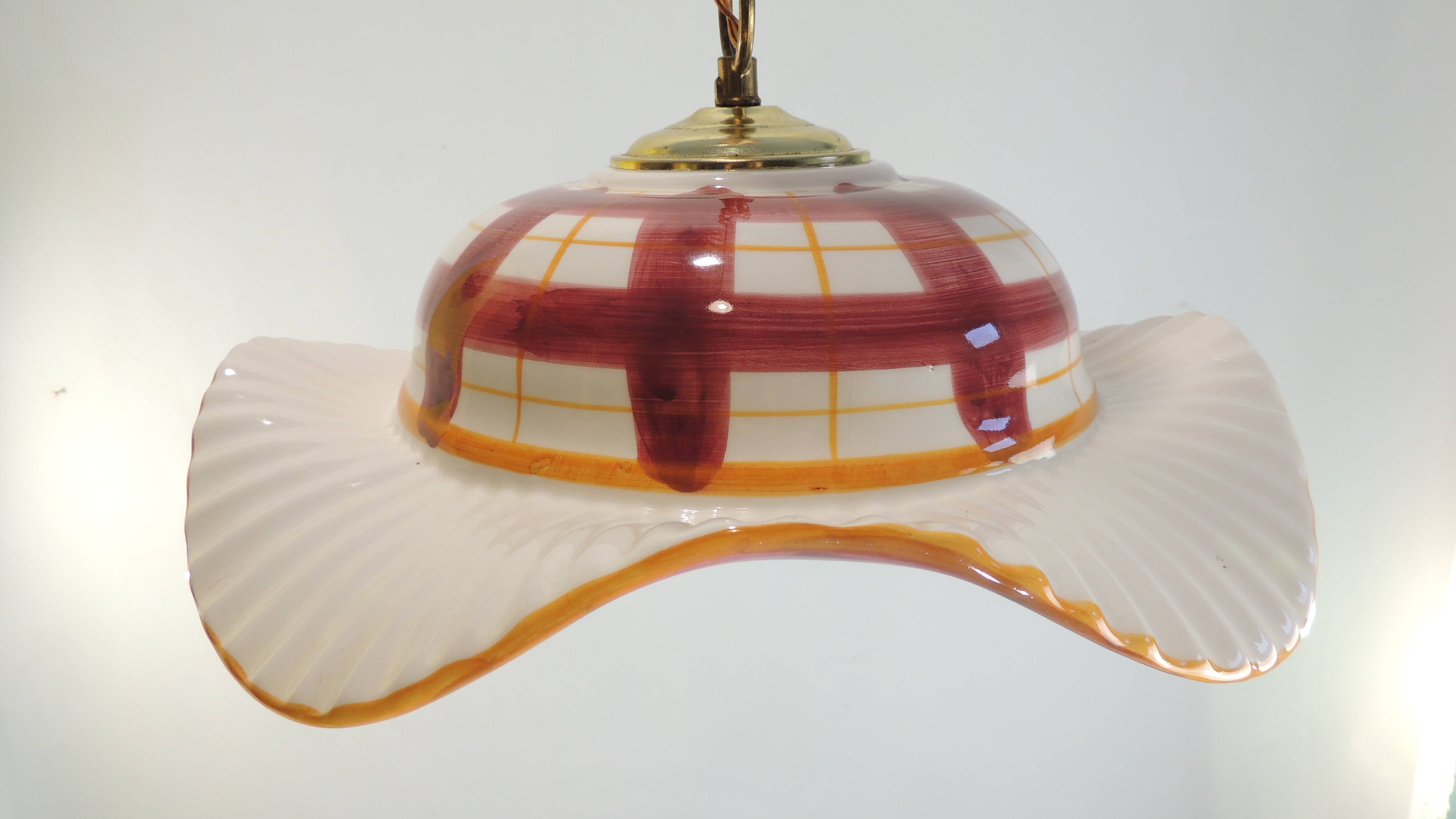 Vintage earthenware pendant light with a burgundy and ochre tartan pattern