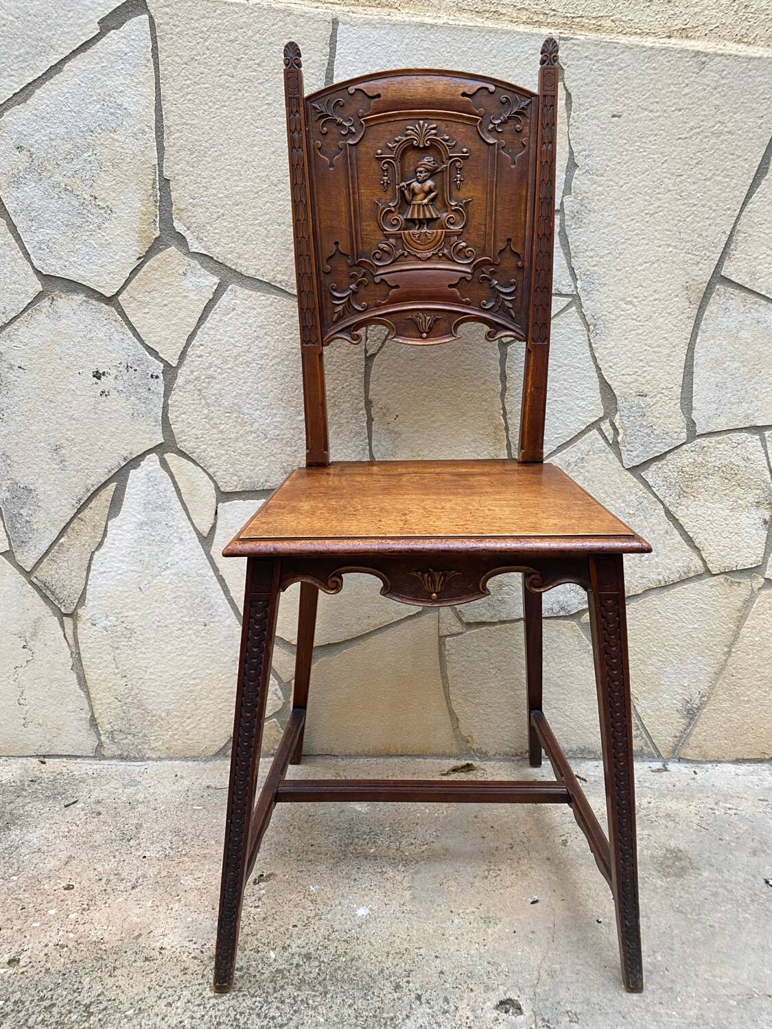 Carved walnut lounge chair