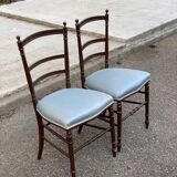 2 Napoleon III chairs in solid wood and blue satin fabric.