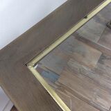 Table basse vintage en laiton et verre biseauté