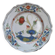 Eastern earthenware plate decorated with a ripe poppy flower