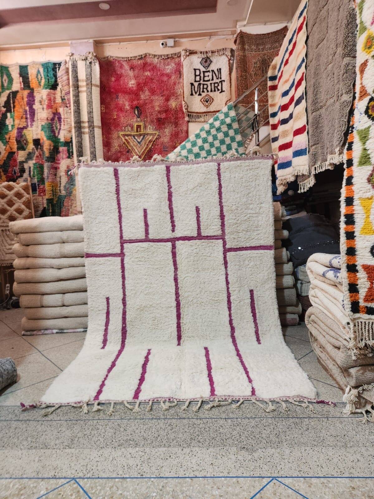 Moroccan Berber rug, cream wool with purple graphic patterns, 300x200 cm.