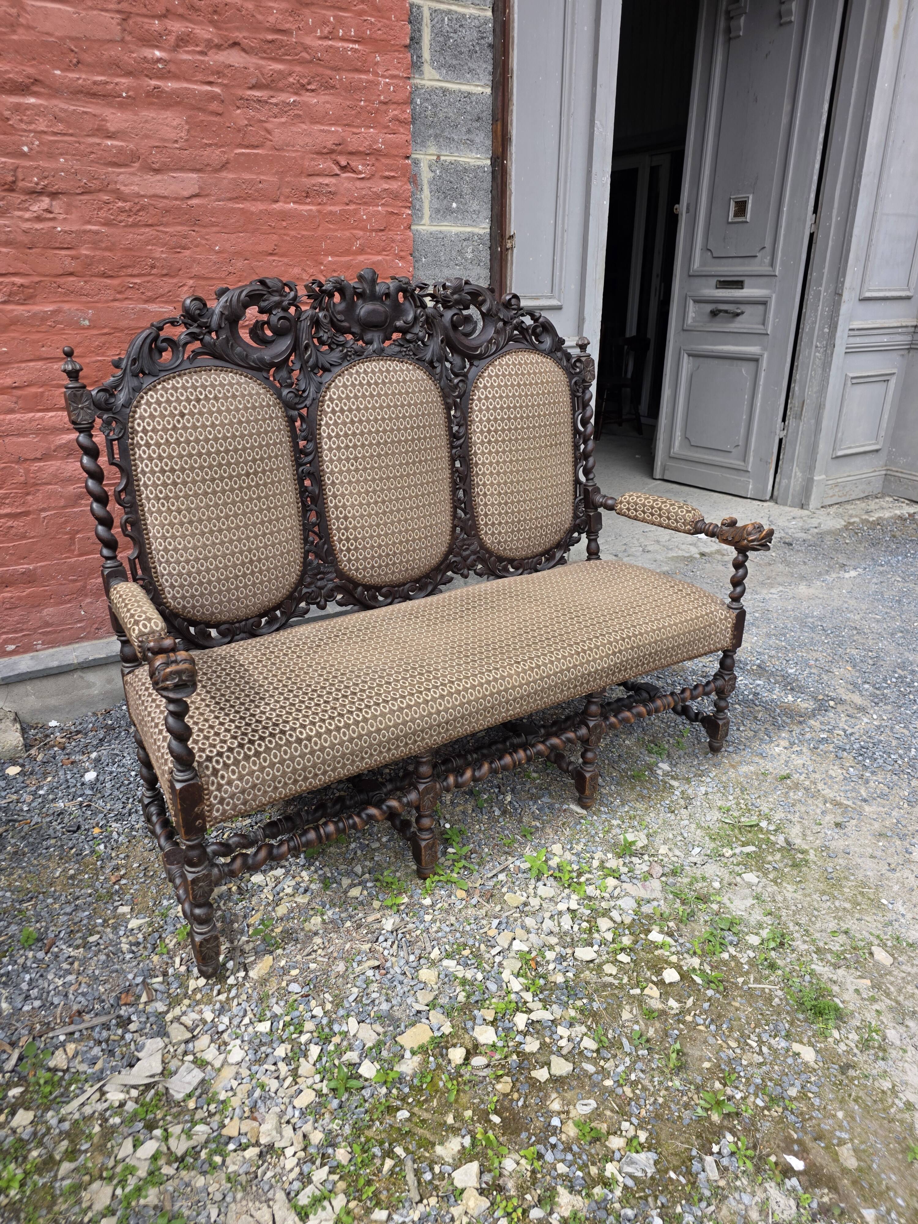 Three-seater armchair in Louis XIII style made of oak from the 19th century.