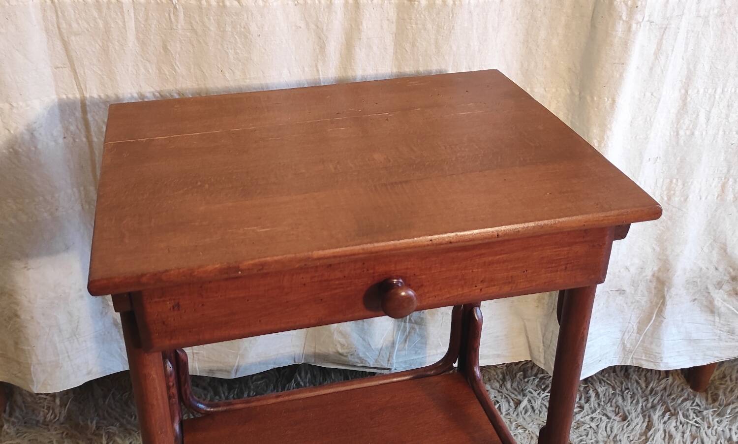 Curved solid wood side table - early 20th century