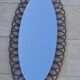 Miroir ovale en rotin années 60