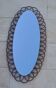 Oval rattan mirror from the 1960s.