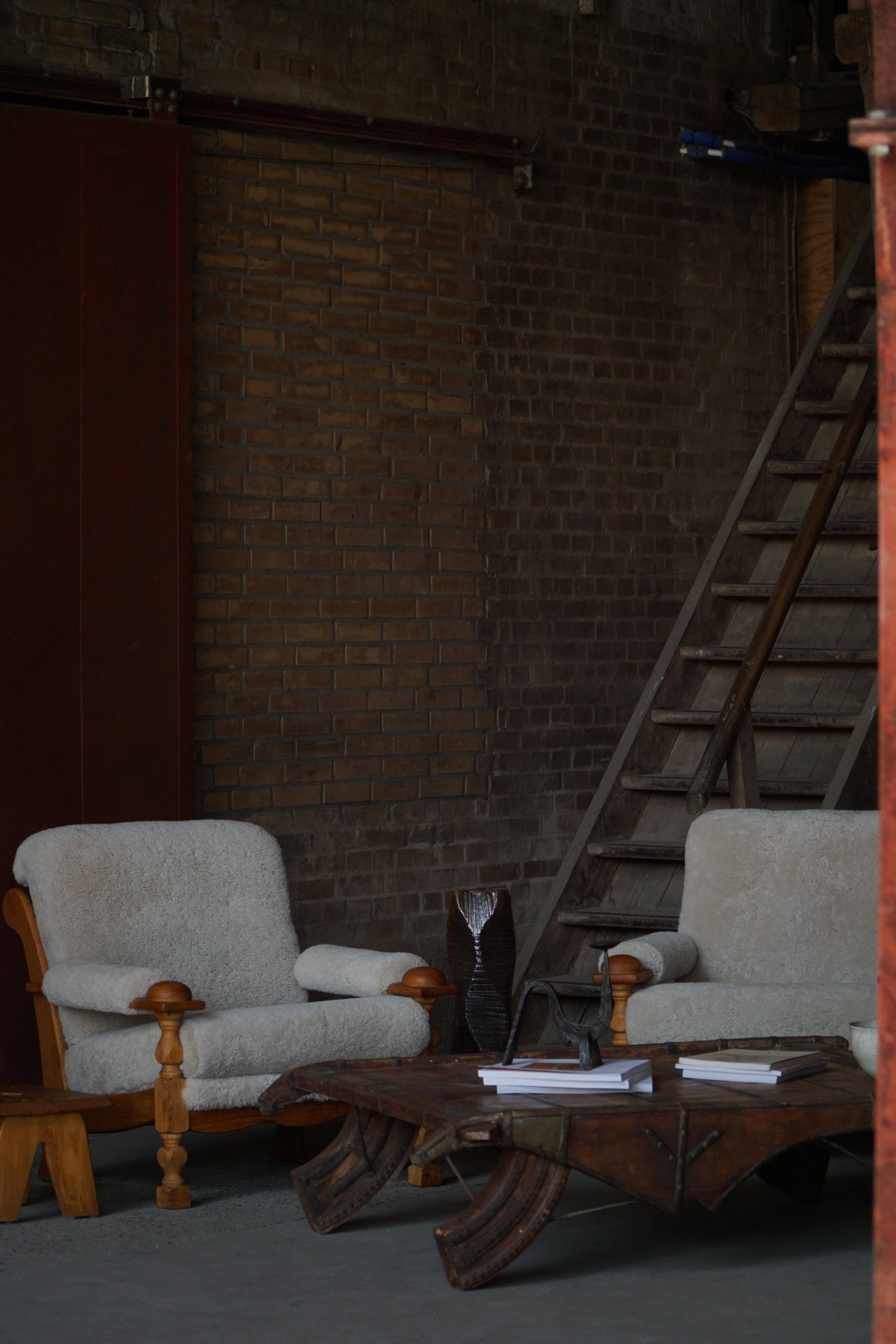 Henning Kjærnulf, lounge chairs in oak and lambswool, mid-century Danish, 1960s.