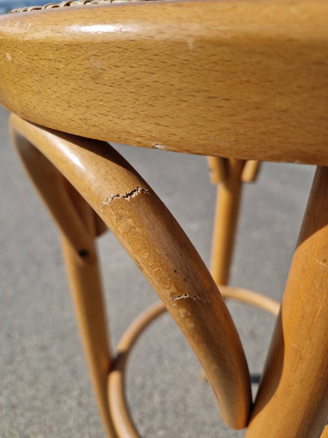 High bar stool in curved wood and cane