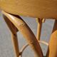 High bar stool in curved wood and cane