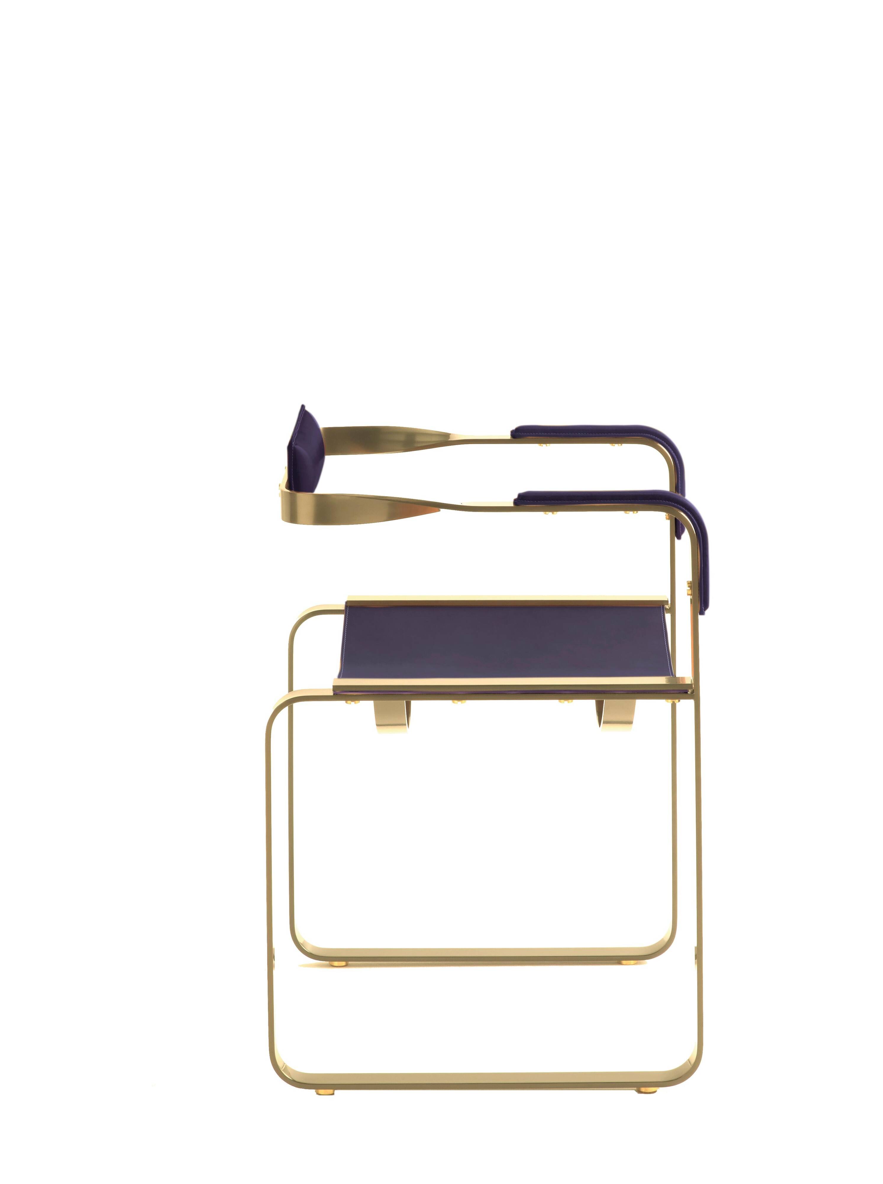 Armchair, aged brass and navy blue leather, contemporary style.
