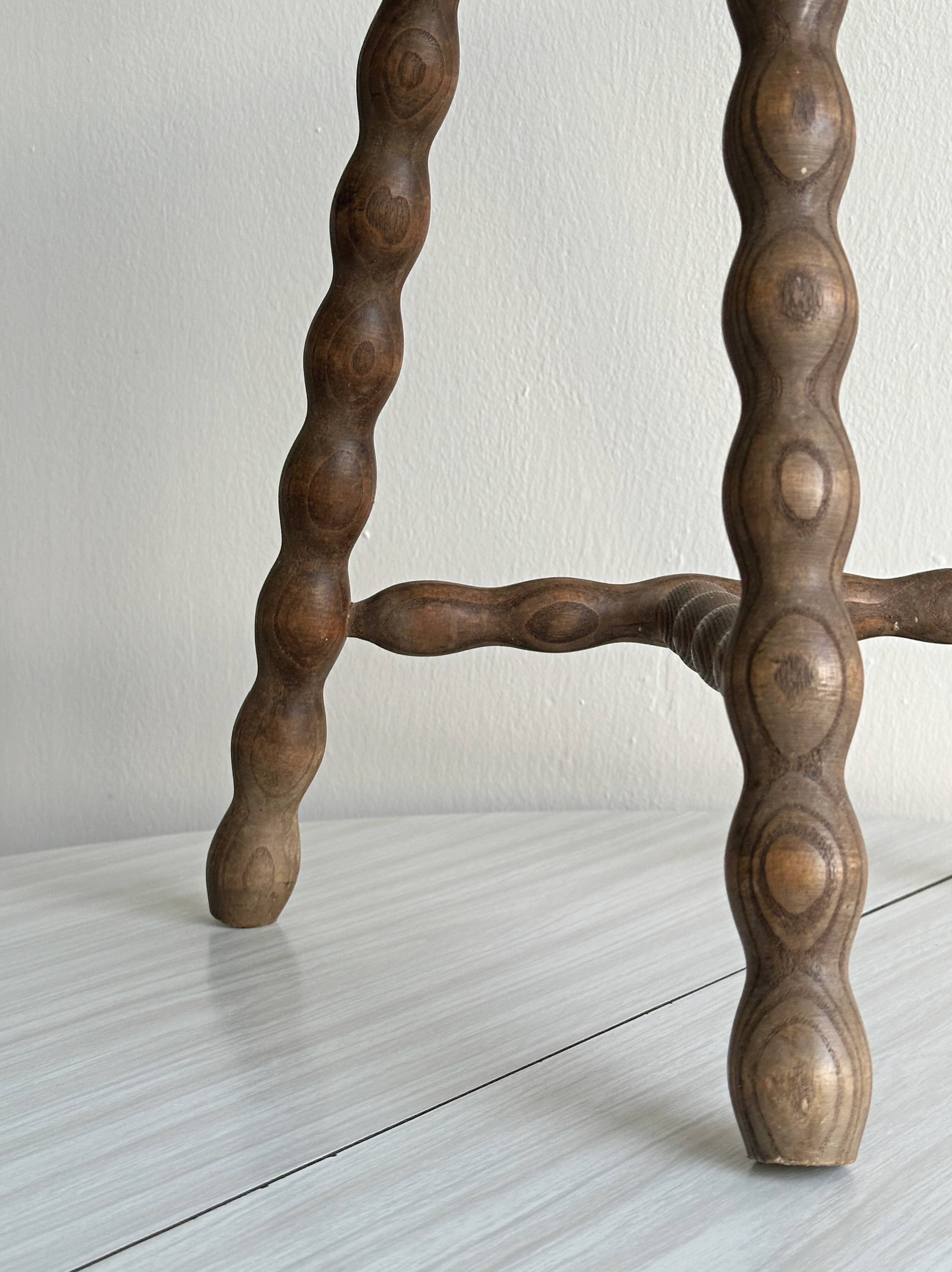Tripod stool with turned wooden legs
