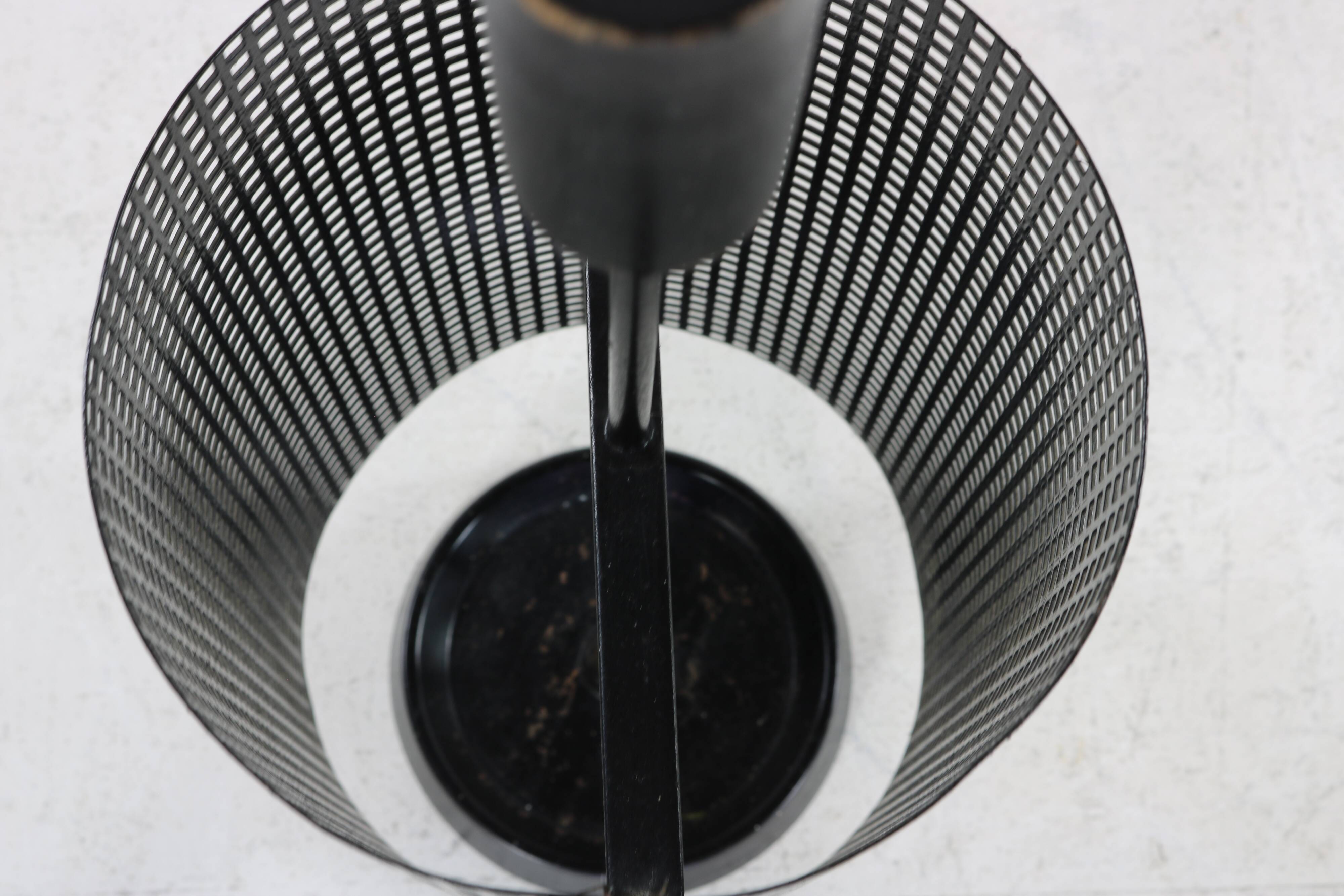 Minimalistic dutch design perforated metal umbrella stand